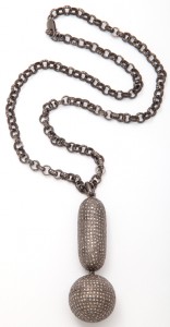 A chain with a long necklace and a large pendant.