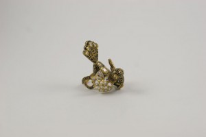 A gold ring with a flower on it