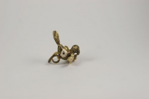 A small snake sitting on top of a white surface.