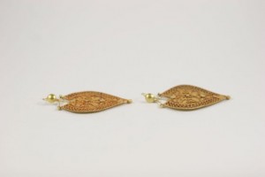 A pair of gold earrings with a diamond shaped design.