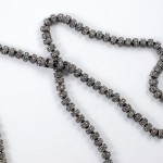 A close up of a string of beads