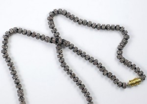 A close up of a string of beads