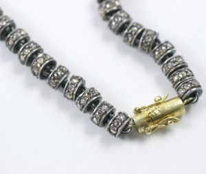 A close up of the side of a necklace