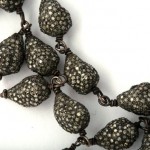 A close up of the beads on a necklace