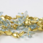 A close up of some gold and blue beads