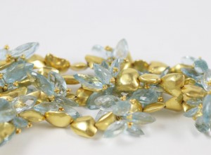 A close up of some gold and blue beads