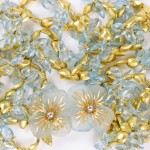 A close up of some gold and blue beads