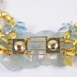 A close up of the gold and blue beads