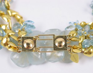 A close up of the gold and blue beads