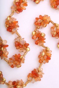A close up of the necklace on a white background