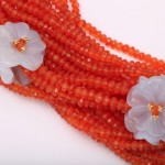 A close up of some beads with flowers on them