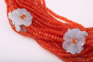 A close up of some beads with flowers on them
