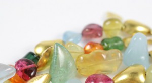 A close up of many different colored candies