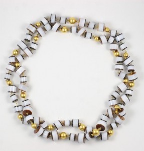 A necklace of white and gold beads is shown.