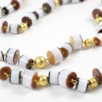 A long necklace of brown and white beads