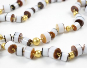 A long necklace of brown and white beads