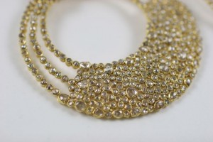 A close up of the bottom part of a necklace