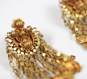 A close up of the earrings on a white background