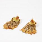 A pair of gold earrings with dangling chains.