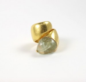 A gold ring with a stone on it