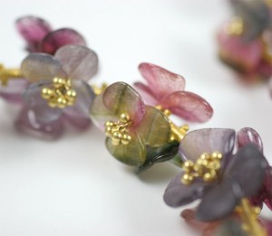 A close up of some flowers with gold accents