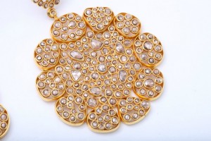 A close up of the large gold necklace