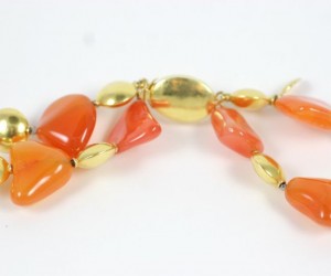 A close up of the necklace on a white background