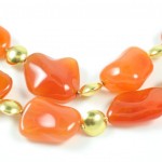 A close up of an orange necklace