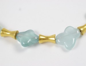 A close up of the bottom part of a necklace