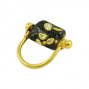 A black and gold ring with diamonds on it