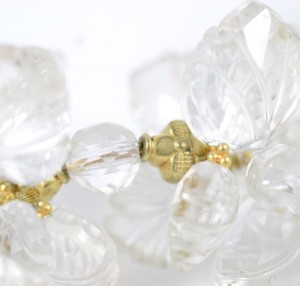 A close up of the gold and clear beads