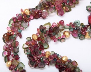 A close up of the necklace on a white background