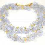 A necklace of blue chalcedony and gold beads.