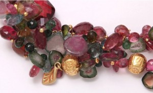 A close up of the necklace with many different colored stones