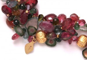 A close up of the necklace with some stones