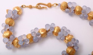 A close up of the necklace on a white background