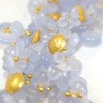 A close up of some white and gold beads