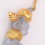 A close up of the gold and blue beads