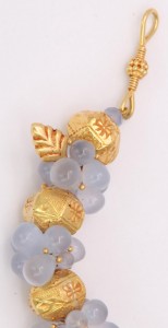 A close up of the gold and blue beads