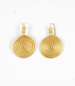 A pair of gold earrings with spiral design.
