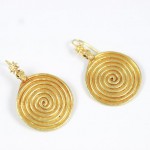 A pair of gold earrings with spirals on them.