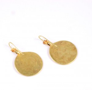 A pair of gold earrings with a round design.