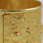 A close up of the gold plated bracelet