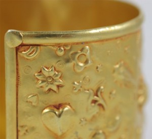 A close up of the gold plated bracelet