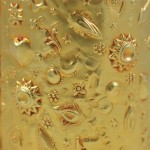 A close up of the gold foil on a glass