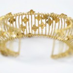 A close up of the golden bracelet