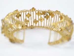 A close up of the golden bracelet