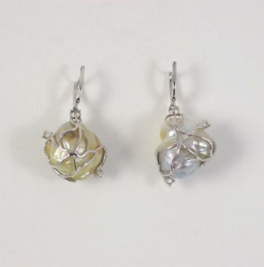 A pair of earrings with silver and gold beads.
