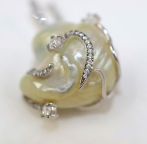 A close up of the ear with diamonds on it