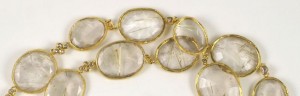 A close up of some gold and clear stones